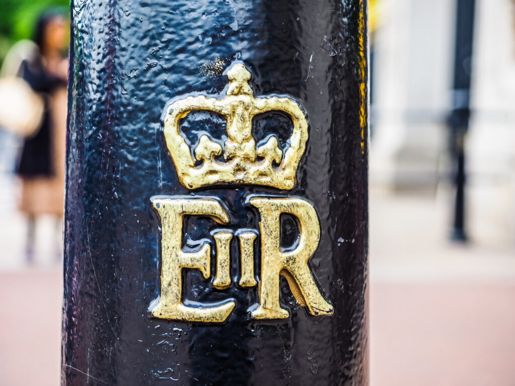 Elizabeth II Regina. The Latin Rex still used in the UK