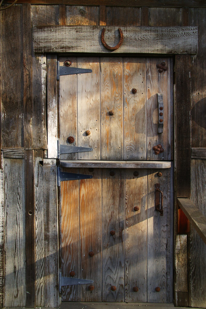 Old Door with Horseshoe nailed to its frame
